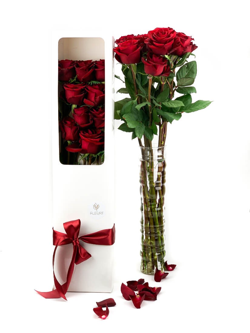 9 stems of long stemmed, red roses in an elegant box