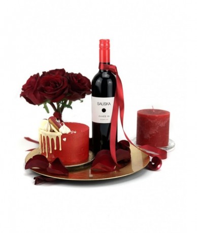 Gift package with red roses, a bottle of quality red wine, candle and a mini cake from Cake Shop