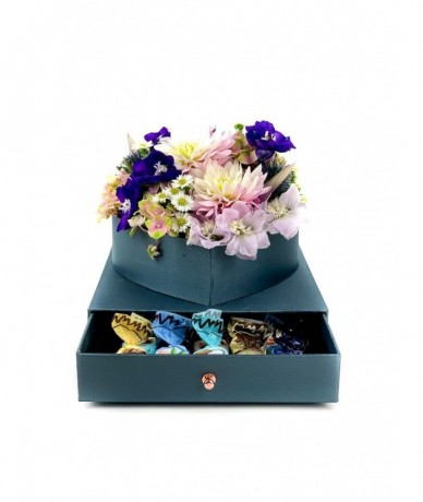 Mixed flowers in an elegant heart-shaped blue box with a drawer