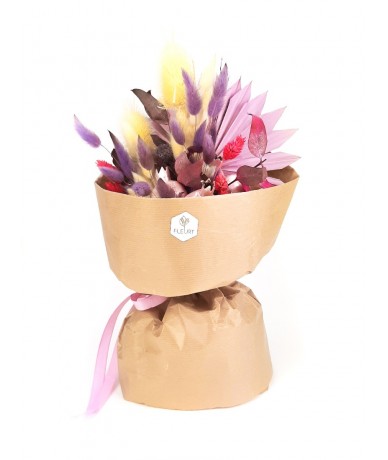Ízléses szárazvirág csokor lila-rózsaszín virágokból papír tasakban