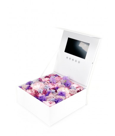 Elegant paper box with video player in the top, flowers in the box.